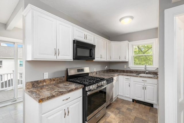 29 Balcomb St Unit 29, Salem, MA 01970 - kitchen with stainless steel appliances, a sink, white cabinets, and stone finish floors