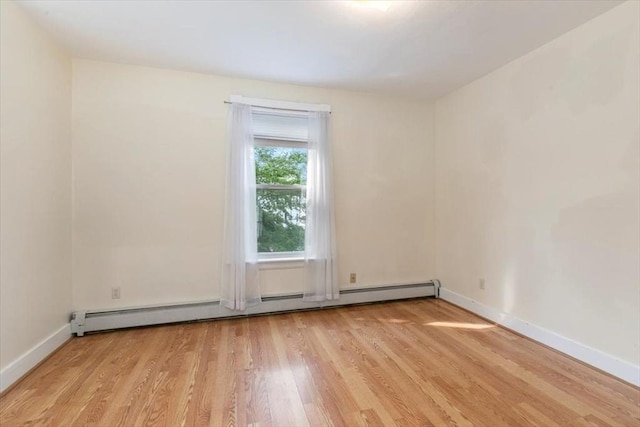 29 Balcomb St Unit 29, Salem, MA 01970 - unfurnished room with a baseboard heating unit, light wood-style floors, and baseboards