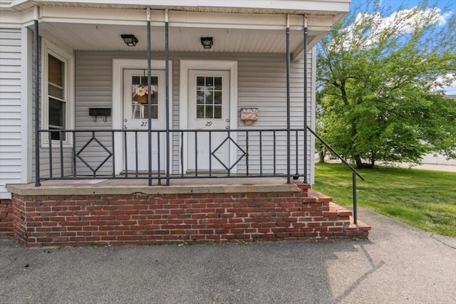 29 Balcomb St Unit 29, Salem, MA 01970 - view of exterior entry with a porch and a yard