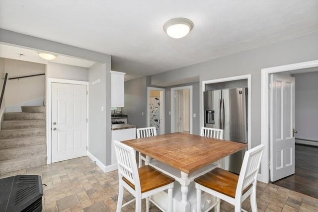 29 Balcomb St Unit 29, Salem, MA 01970 - dining space featuring stone tile flooring, baseboard heating, stairway, and baseboards