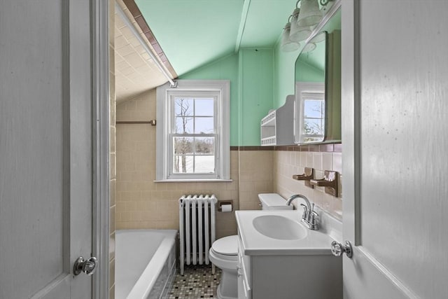 bathroom featuring toilet, a bathtub, radiator heating unit, tile walls, and lofted ceiling