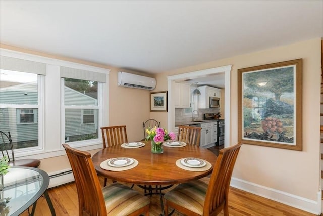 38 Pasho St, Andover, MA 01810 - dining area featuring an AC wall unit and light wood-style flooring