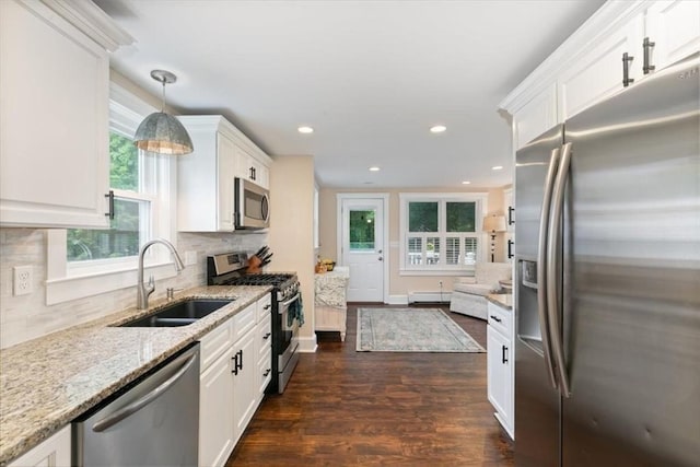 38 Pasho St, Andover, MA 01810 - kitchen featuring appliances with stainless steel finishes, white cabinets, healthy amount of natural light, and recessed lighting