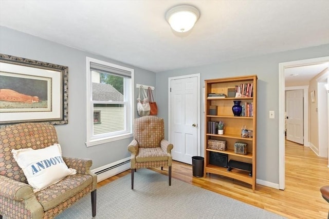 38 Pasho St, Andover, MA 01810 - sitting room with a baseboard heating unit and light wood finished floors