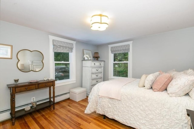 38 Pasho St, Andover, MA 01810 - bedroom featuring baseboard heating and wood finished floors
