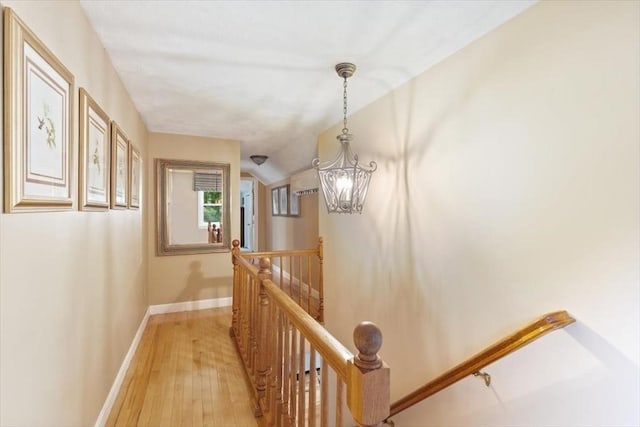 38 Pasho St, Andover, MA 01810 - corridor with an upstairs landing, light wood-type flooring, and a chandelier