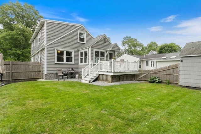 38 Pasho St, Andover, MA 01810 - back of property with a wooden deck and a fenced backyard