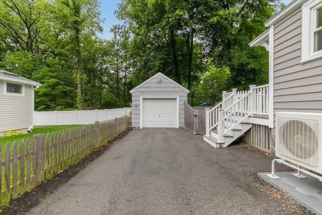 38 Pasho St, Andover, MA 01810 - detached garage with driveway and view of wooded area