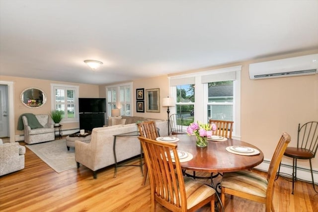38 Pasho St, Andover, MA 01810 - dining space featuring a wall mounted air conditioner, light wood finished floors, and a baseboard radiator