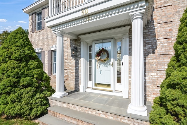 entrance to property with a balcony