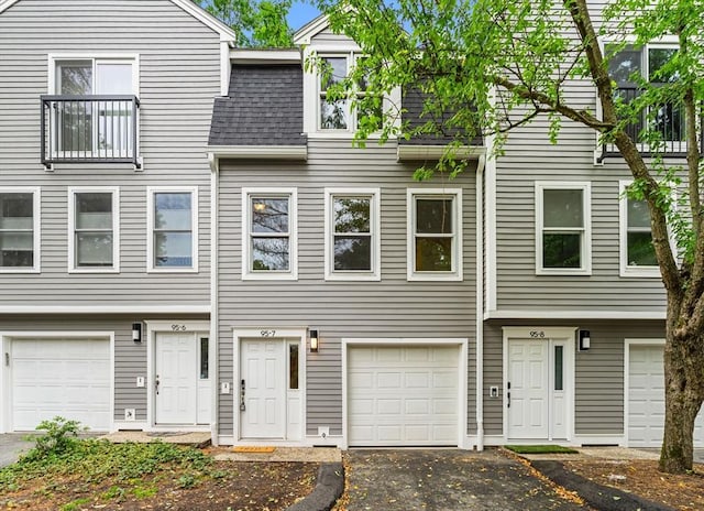 95 Anderer Ln Unit 7, Boston, MA 02132 - view of property featuring a shingled roof and asphalt driveway