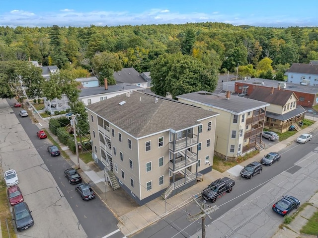 bird's eye view featuring a wooded view