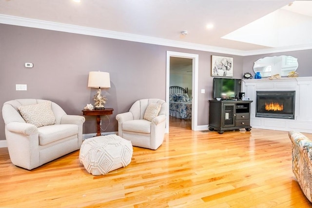 38 Gold Leaf, Mashpee, MA 02649 - living room with crown molding, wood finished floors, and a glass covered fireplace