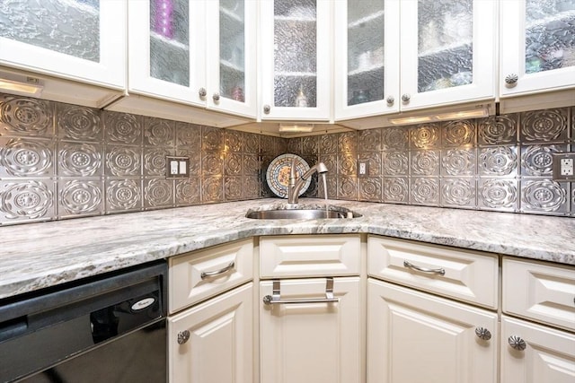 38 Gold Leaf, Mashpee, MA 02649 - kitchen with dishwashing machine, white cabinetry, light stone counters, decorative backsplash, and glass insert cabinets