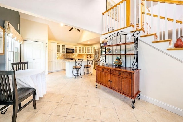 38 Gold Leaf, Mashpee, MA 02649 - interior space with tile patterned flooring, a ceiling fan, and high vaulted ceiling