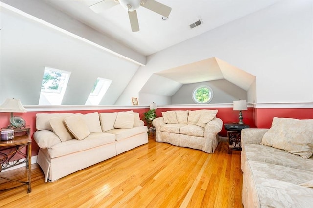 38 Gold Leaf, Mashpee, MA 02649 - living room featuring wood finished floors, a skylight, lofted ceiling, and a ceiling fan