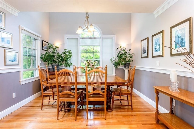 38 Gold Leaf, Mashpee, MA 02649 - dining area featuring ornamental molding, light wood finished floors, and a chandelier