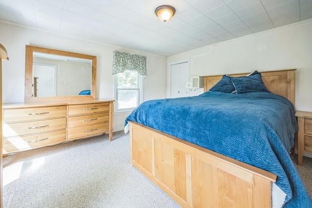 bedroom with light colored carpet