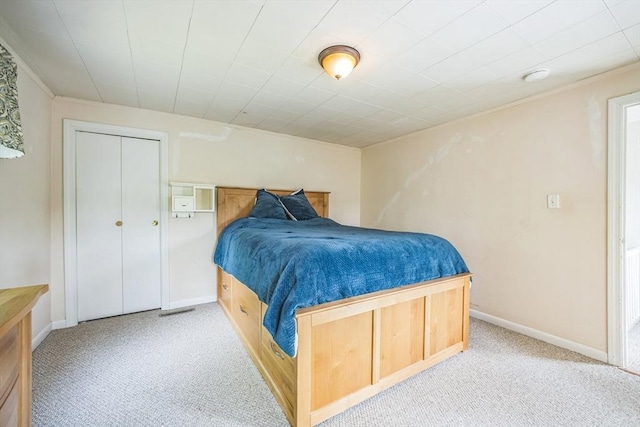 bedroom with carpet flooring and baseboards