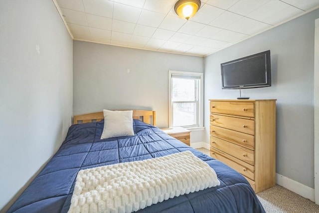 bedroom with carpet flooring and baseboards