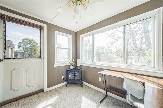 sunroom featuring a wood stove