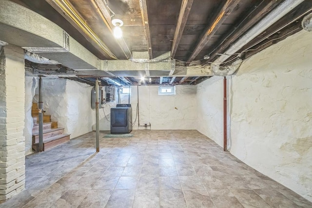 below grade area featuring washer / clothes dryer and stairway