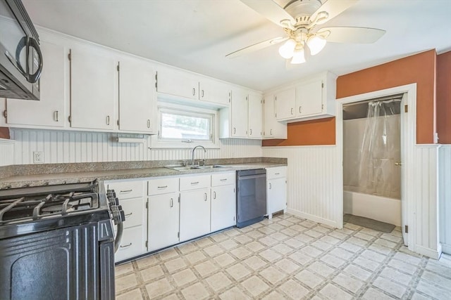 kitchen featuring dishwashing machine, light flooring, gas range oven, a sink, and a ceiling fan