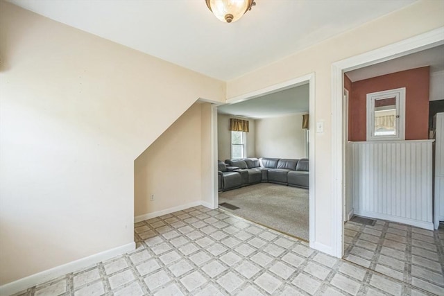 living room with light flooring and baseboards