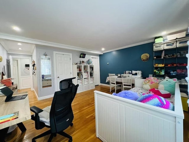 bedroom with crown molding, baseboards, recessed lighting, and wood finished floors
