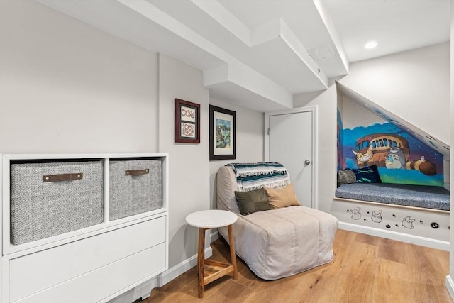 living area featuring wood finished floors and baseboards