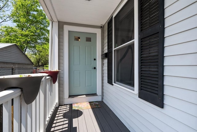 property entrance featuring covered porch