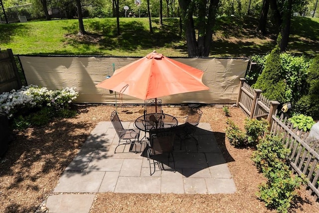 view of patio featuring outdoor dining area