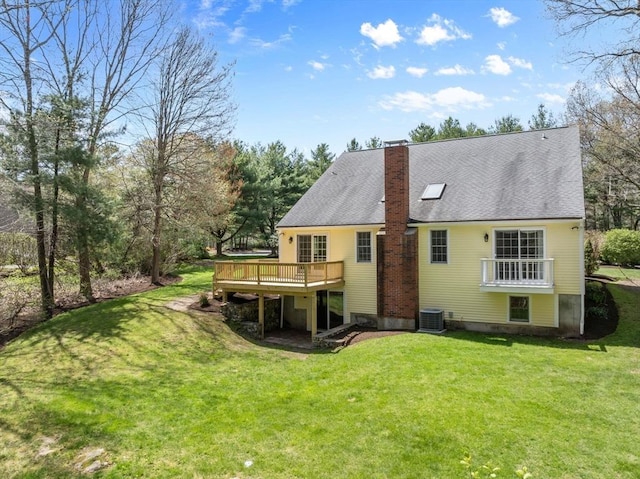 back of house with a lawn, a wooden deck, central AC, and a chimney