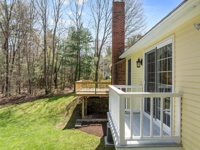wooden terrace with a yard and central AC