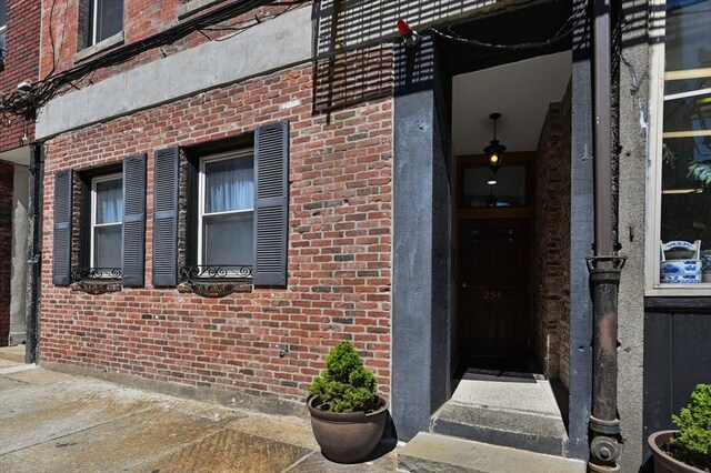 entrance to property with brick siding