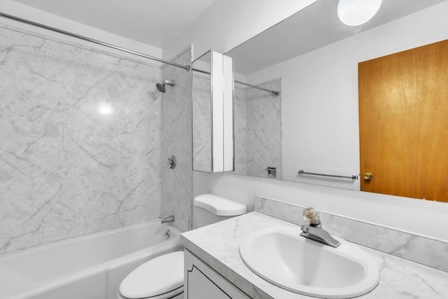 full bathroom featuring vanity, toilet, and tiled shower / bath