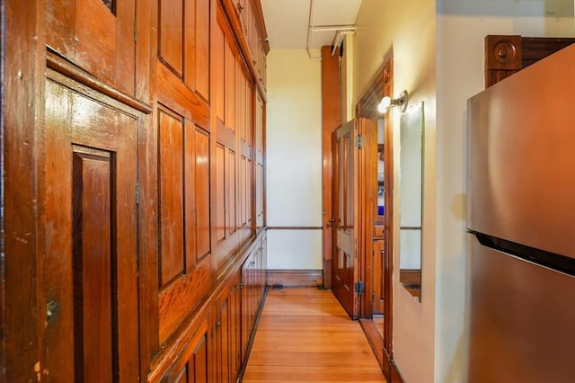 corridor featuring light hardwood / wood-style floors