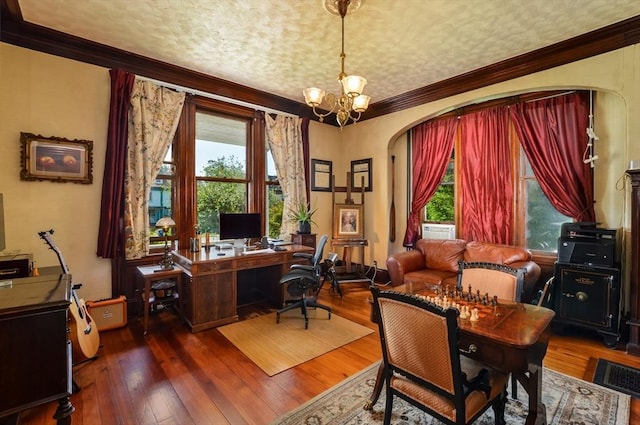 home office featuring ornamental molding, a healthy amount of sunlight, an inviting chandelier, and dark hardwood / wood-style flooring