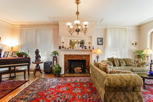 interior space with ornamental molding, a chandelier, and hardwood / wood-style floors