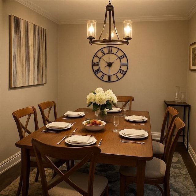 221 Oak St Unit 2-23, Brockton, MA 02301 - dining space with dark wood-style floors, baseboards, ornamental molding, and a chandelier