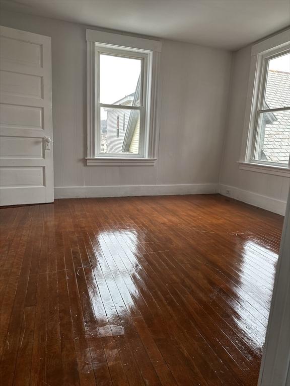 empty room featuring dark hardwood / wood-style floors