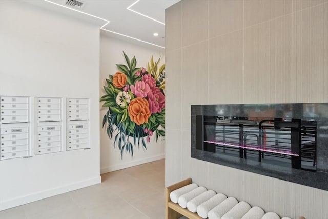 256 Dorchester St Unit 408, Boston, MA 02127 - interior space featuring mail area, tile patterned flooring, and baseboards
