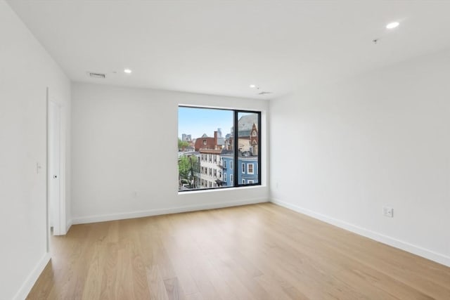 256 Dorchester St Unit 408, Boston, MA 02127 - empty room with light wood finished floors, recessed lighting, and baseboards