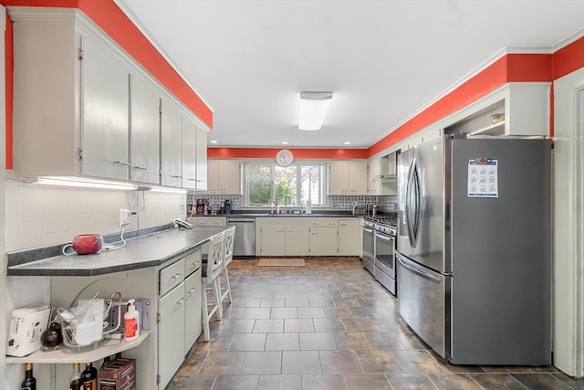 41 Edwards St, Southbridge, MA 01550 - kitchen with stainless steel appliances, tasteful backsplash, dark countertops, wall chimney range hood, and ornamental molding