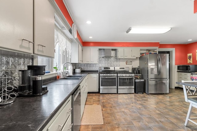 41 Edwards St, Southbridge, MA 01550 - kitchen with appliances with stainless steel finishes, wall chimney range hood, dark countertops, tasteful backsplash, and white cabinets
