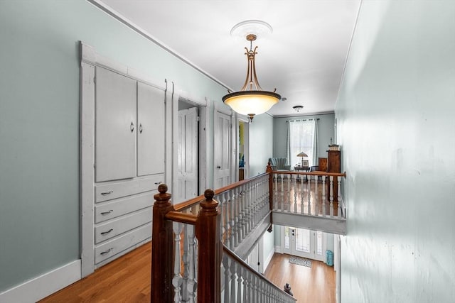 41 Edwards St, Southbridge, MA 01550 - hallway with an upstairs landing, light wood finished floors, and ornamental molding