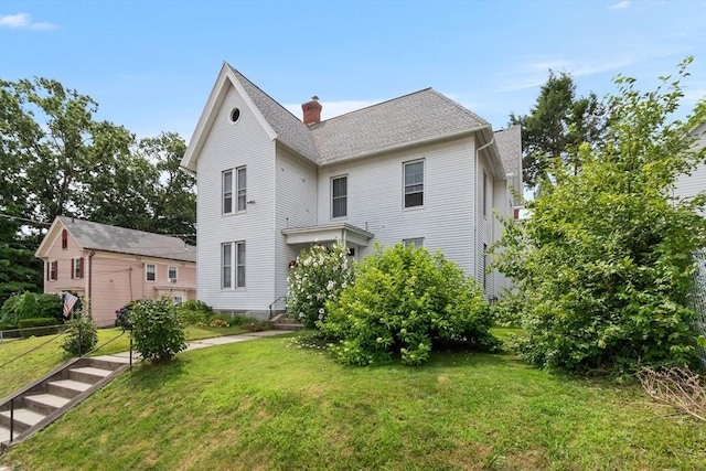 41 Edwards St, Southbridge, MA 01550 - rear view of house with a lawn, a chimney, and a shingled roof