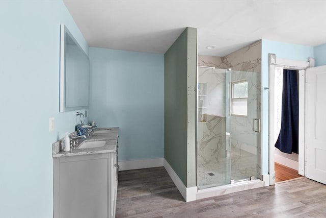 41 Edwards St, Southbridge, MA 01550 - full bathroom with double vanity, a marble finish shower, and wood finished floors