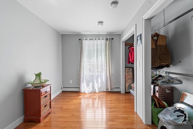 41 Edwards St, Southbridge, MA 01550 - bedroom featuring a baseboard radiator, light wood-style flooring, and baseboard heating