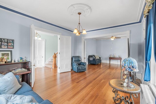 41 Edwards St, Southbridge, MA 01550 - living room featuring stairs, crown molding, and light wood-style floors